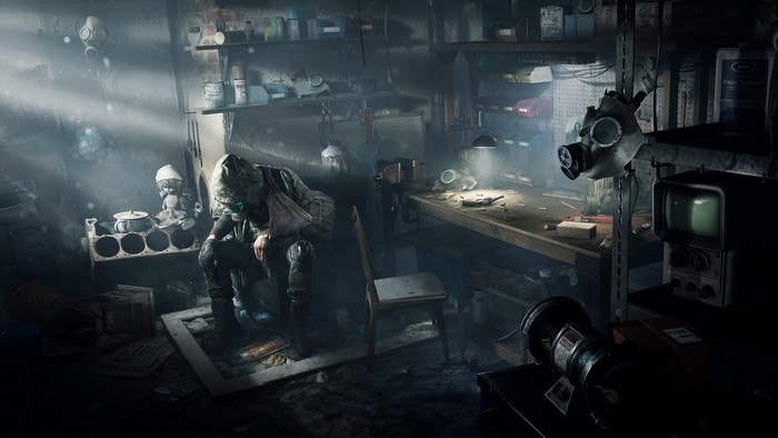 Man in gas mask in a workshop