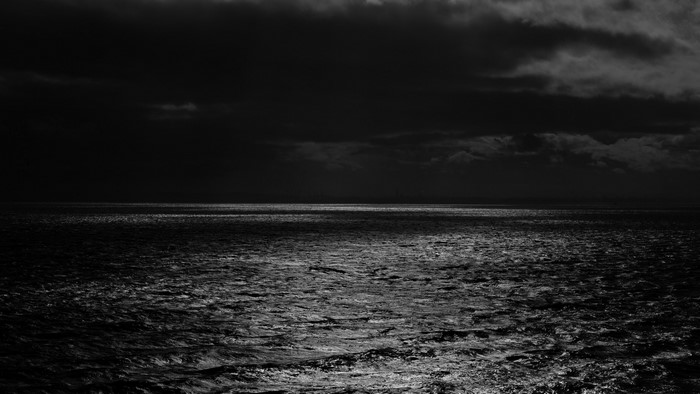 Dark Ocean Under Moonlight
