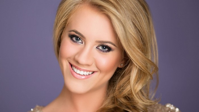 Young woman with blonde hair smiling
