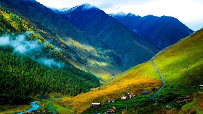 Blue mountains with green valley and river