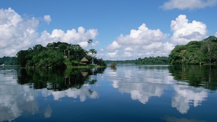 Amazon River with Lush Green Islands and Blue Sky