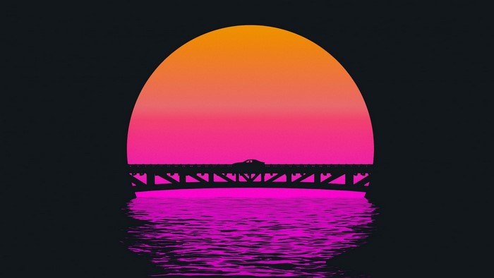 Car on a bridge at sunset over water