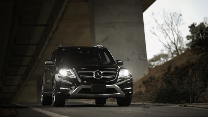 Black Mercedes-Benz GLK350 parked under a bridge