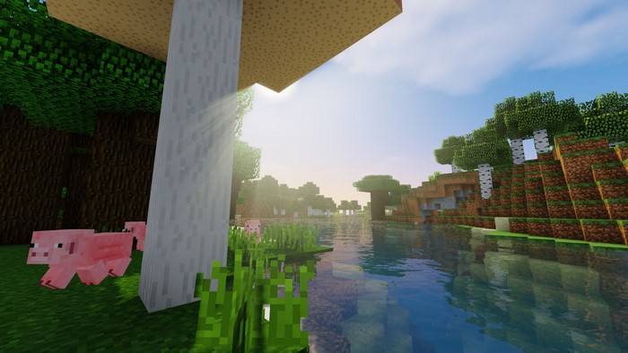 Minecraft landscape with pigs and a lake