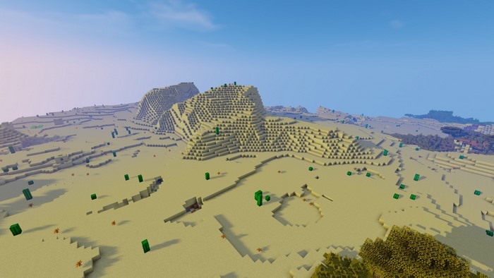 Minecraft desert landscape with mountains and cacti