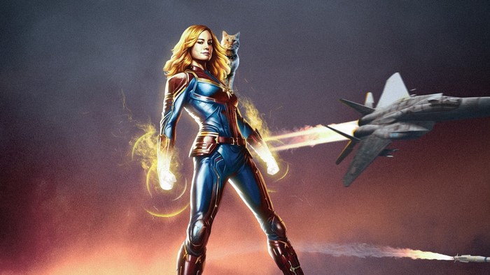 Captain Marvel holding Goose the cat with a jet in the background