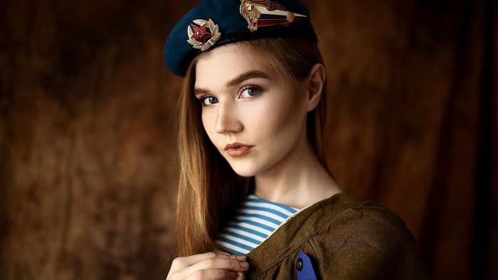 Girl in military uniform and beret