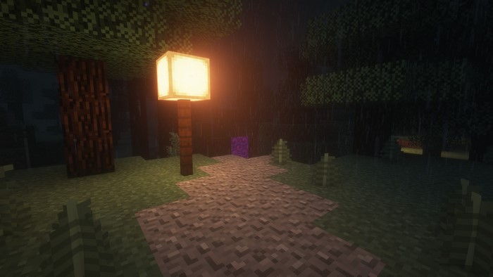 Minecraft scene with a lit lamp post and a portal