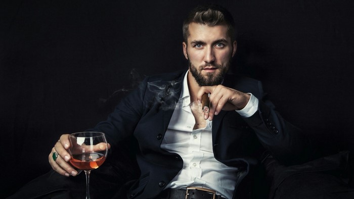 Man in Suit Smoking Cigar and Drinking Wine
