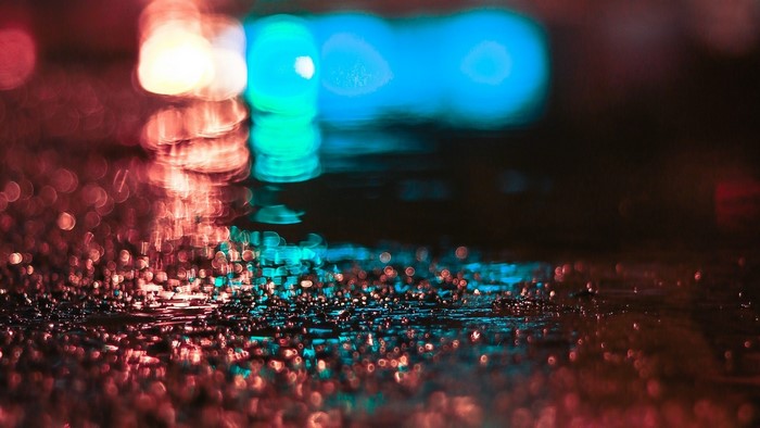 Abstract bokeh lights on wet surface