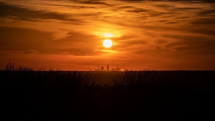 Sunset over a city skyline
