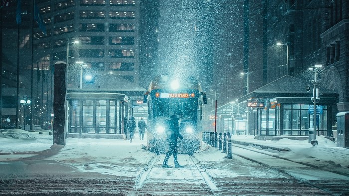 Train station in snowfall with "Mall of America" sign
