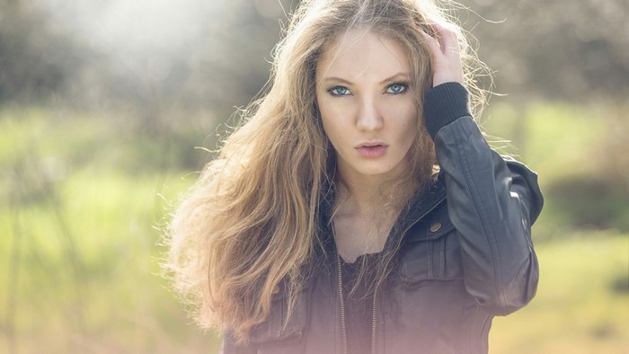 Young woman with blonde hair in a jacket