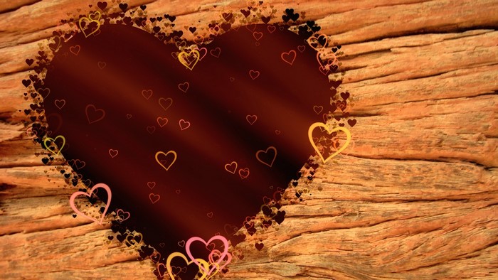 Heart frame on wooden background