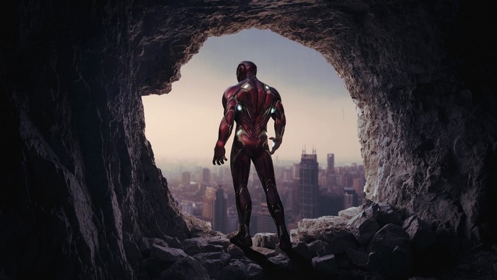 Iron Man from Avengers Endgame in a cave overlooking a city