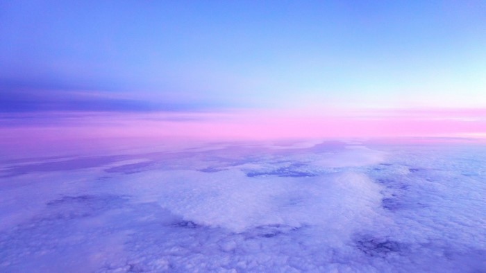 Clouds at sunset from airplane window