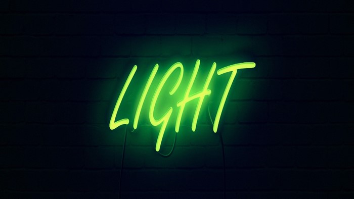 Green neon sign spelling "LIGHT"