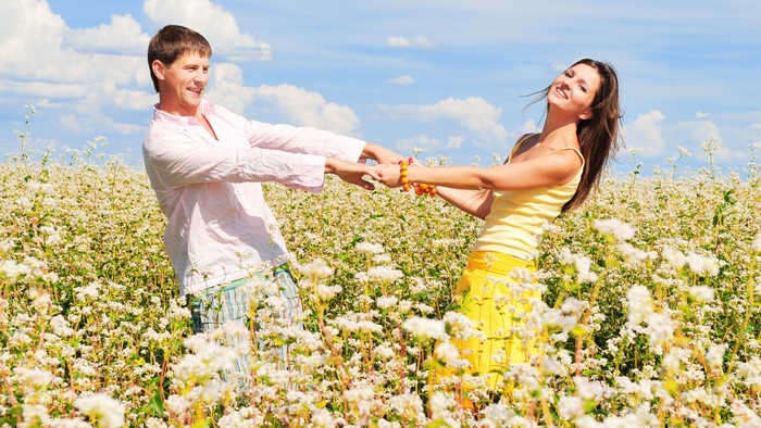 Couple dancing in a field of flowers