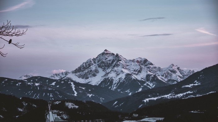 Snow-covered mountain range at dusk