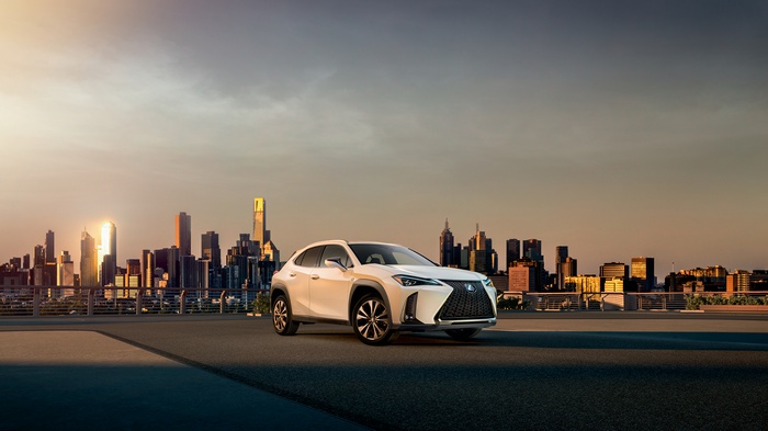 Lexus UX 250h F Sport in city at sunset 4K