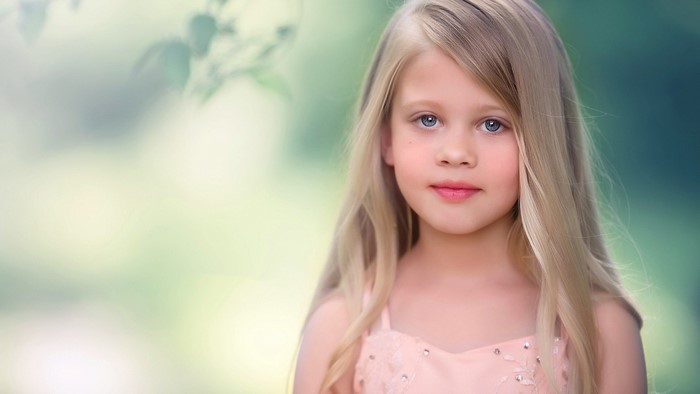 Young girl with blonde hair and blue eyes