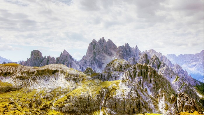 Mountain landscape with sharp peaks and cloudy sky