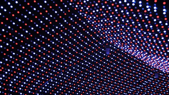 Rows of red and white lights on a dark background