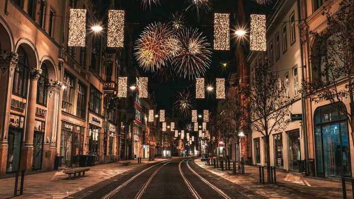 City street at night with fireworks and lights