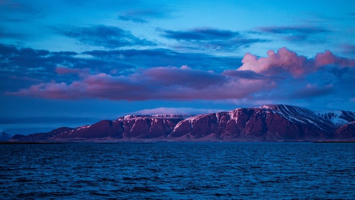 Mountains and ocean at dusk in Iceland