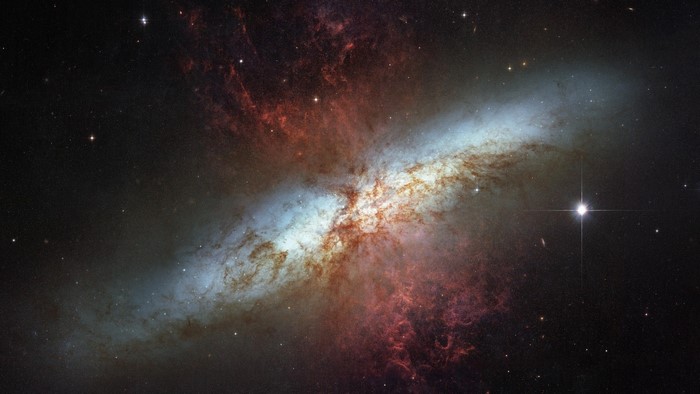 Galaxy with red and blue nebulae