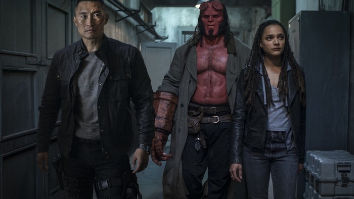 Hellboy and allies in a hallway