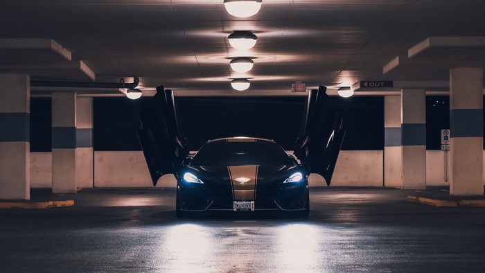 McLaren sports car with butterfly doors open