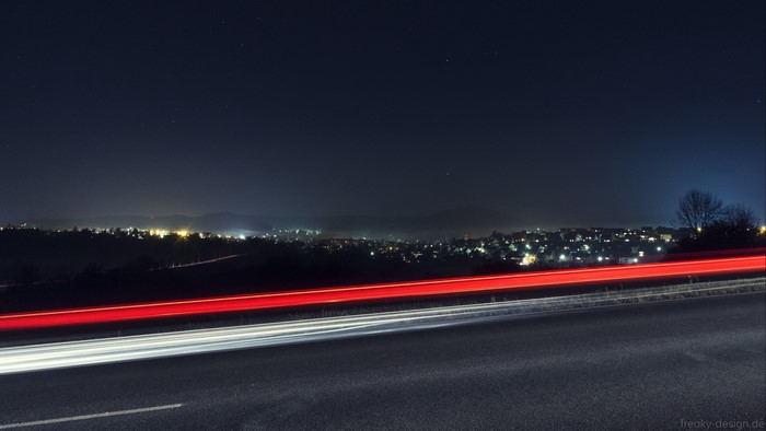 Night city with light trails