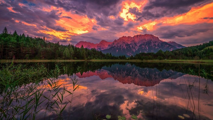 Mountain reflection in lake at sunset