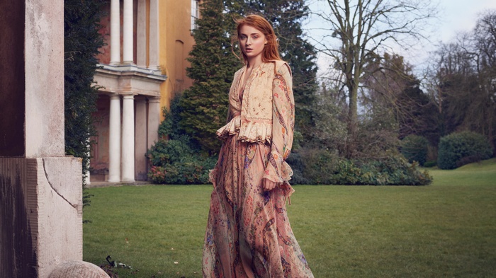 Sophie Turner in a floral dress outdoors