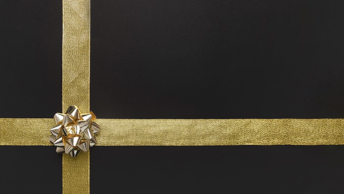 Gold ribbon and bow on black background
