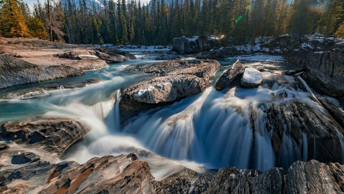 Waterfall in a Rocky Forest Landscape