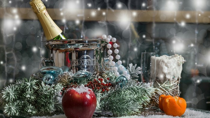 Martini champagne bottle in ice bucket with festive decorations