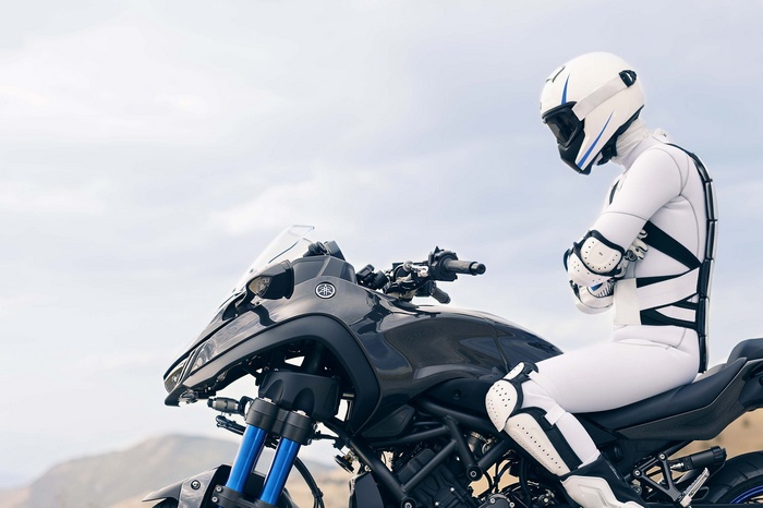 Yamaha NIKEN motorcycle with rider in white suit