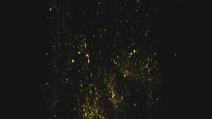 Gold glitter particles falling on black background
