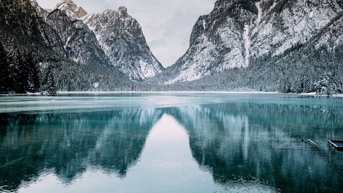 Snowy Mountains Reflecting in a Clear Winter Lake