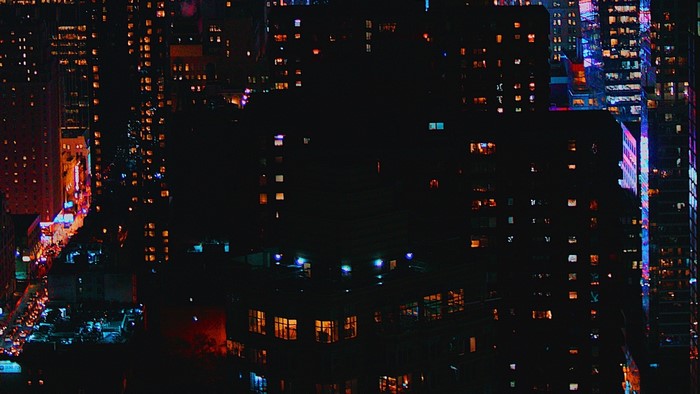 Night city skyline with illuminated buildings