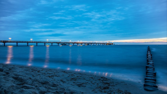 Pier over the ocean at dusk