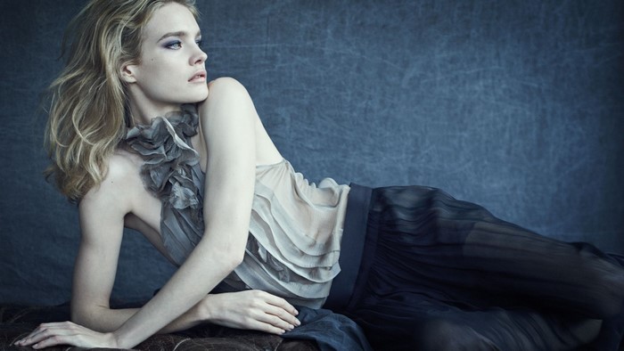 Natalia Vodianova posing in a grey dress