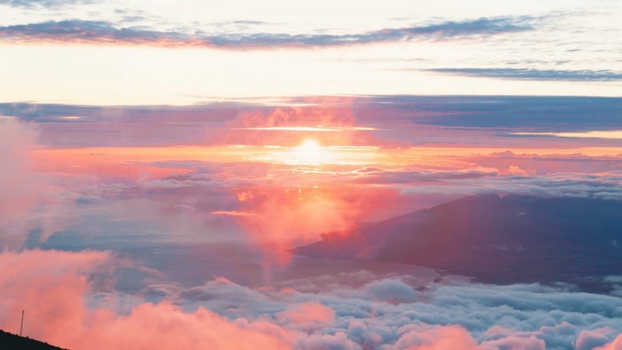 Sunrise over clouds and mountains