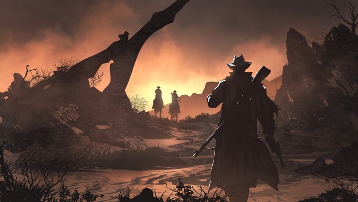 Cowboys on horseback in a desolate landscape at sunset