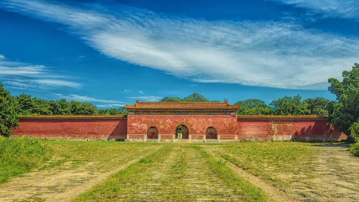 Ancient Chinese Temple Gate with Red Walls