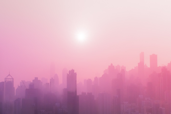 Pink Foggy Cityscape with Sun