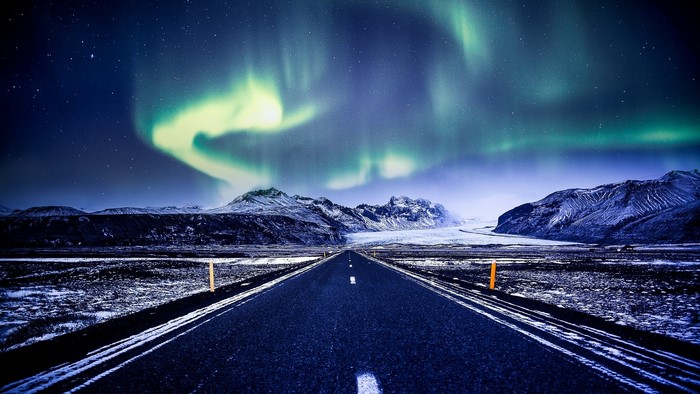 Road to Northern Lights over Mountains