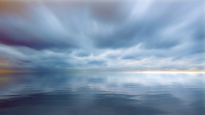 Stormy clouds over a calm sea